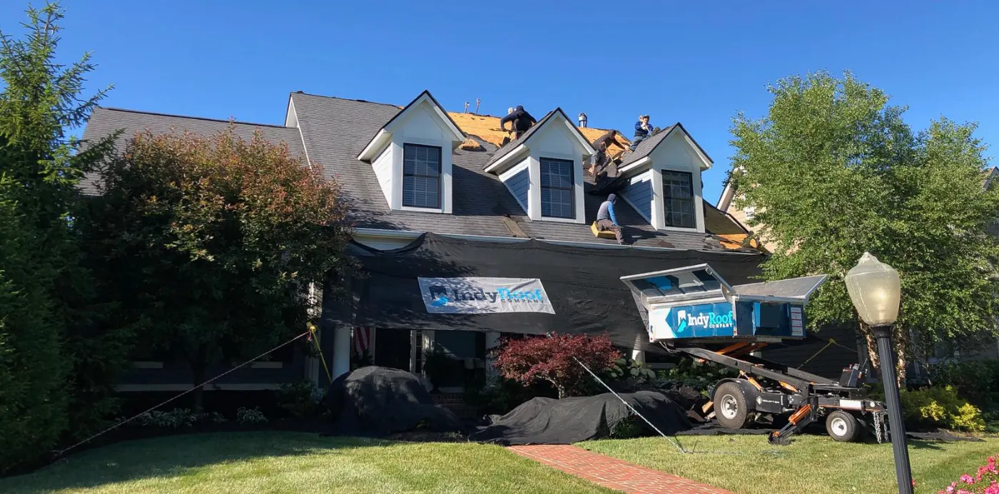 Tarping and dry-in on a Gas City commercial roof